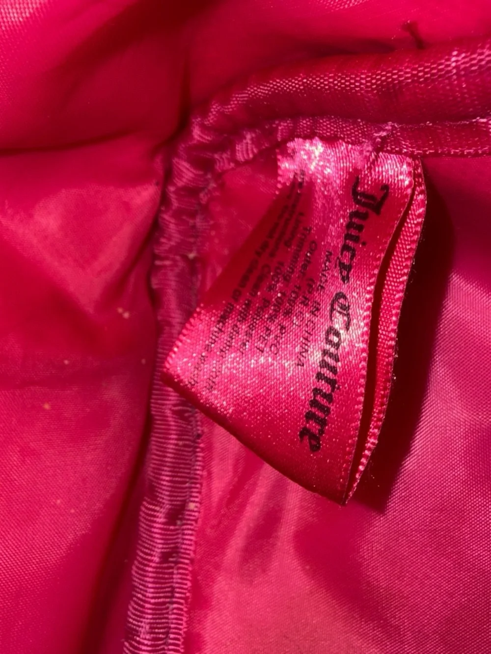 Women's Juicy Couture Hot Pink and Black Sequin backpack with gold detailing.